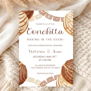 May include: A gender reveal invitation with a watercolor design. The invitation features the text "There's a Little Conchita Baking in the Oven!" and details for the event, including the names Victoria & Juan, date, time, and location.