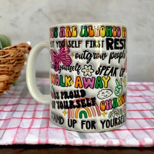 Ceramic mug with motivational sayings in 3-D look, actually smooth, perfect for your morning coffee or tea.