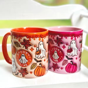 Original 2023 Rosa oder Orange Kaffeetasse mit Geistern, Kürbissen und anderen Halloween Motiven 330ml. Die Tasse ist glatt, nicht geprägt.