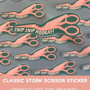 May include: Green and coral stork scissor stickers with the text "SNIP SNIP HOORAY!". The stickers feature a classic stork scissor design, ideal for sewists, embroiderers, and crafters.