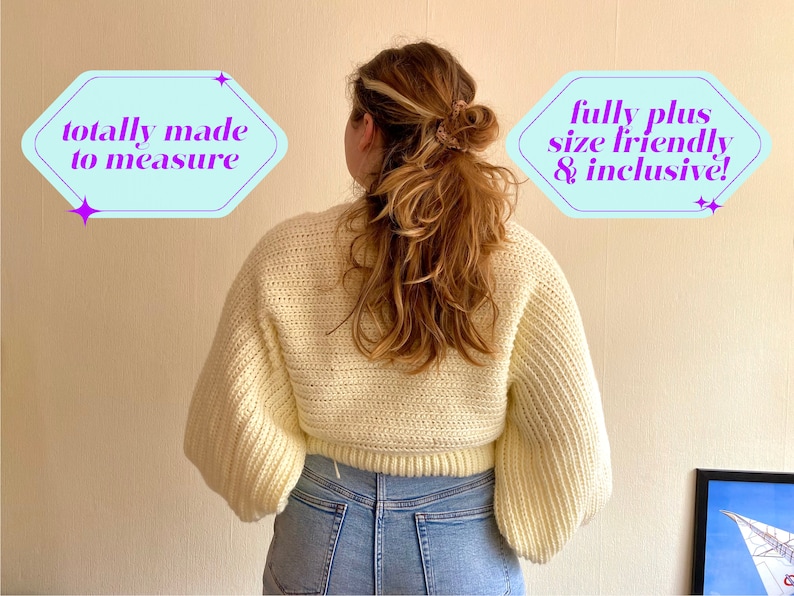 May include: A cream-colored, cropped sweater with long, voluminous sleeves. The sweater is made of a chunky knit material. Text in the image reads "totally made to measure" and "fully plus size friendly & inclusive!"