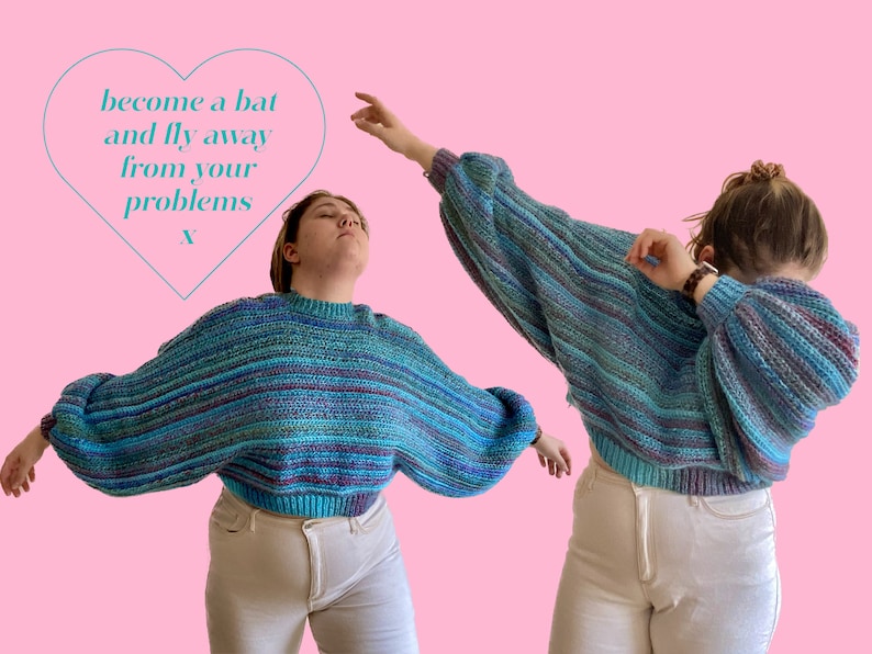 May include: Two people wearing a blue, teal, and purple striped sweater with balloon sleeves and a ribbed hem. The text "become a bat and fly away from your problems" is inside a heart shape. The background is pink.
