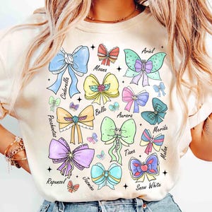 Coquette Bows Watercolor Disney Princess Shirt, Disney Aurora Ariel Belle Cinderella Tiana Shirt, Magic Kingdom Disneyland Girl Trip 2025