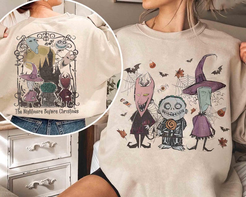 Puede incluir: Sudadera beige con un gr&aacute;fico de "Pesadilla antes de Navidad". El dise&ntilde;o incluye personajes como Jack Skellington y Sally, con murci&eacute;lagos, telara&ntilde;as y caramelos. El texto "The Nightmare Before Christmas" tambi&eacute;n es visible.