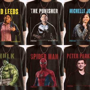 May include: Black t-shirts featuring various characters from the Spider-Man universe. Each shirt displays a different character's name in a colored box, along with an image of the character. The characters include Ned Leeds, The Punisher, Michelle Jones, Hulk, Spider-Man, and Peter Parker.