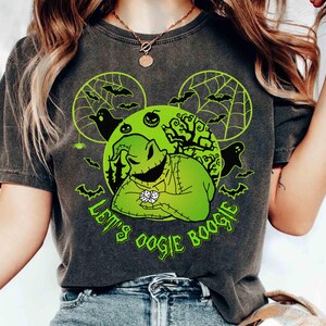May include: Dark gray t-shirt featuring a neon green graphic of Oogie Boogie from The Nightmare Before Christmas. The design includes bats, ghosts, and the text "Let's Oogie Boogie."
