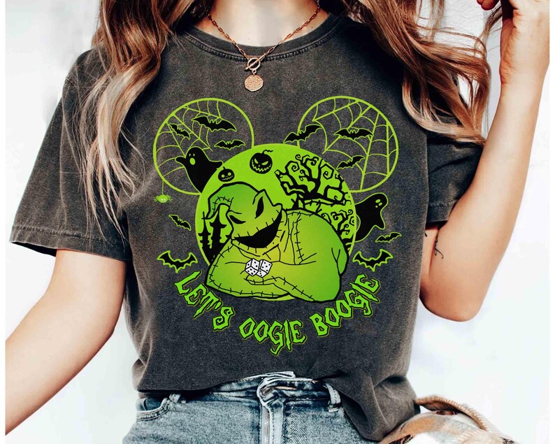May include: Dark gray t-shirt featuring a neon green graphic of Oogie Boogie from The Nightmare Before Christmas. The design includes bats, ghosts, and the text "Let's Oogie Boogie."