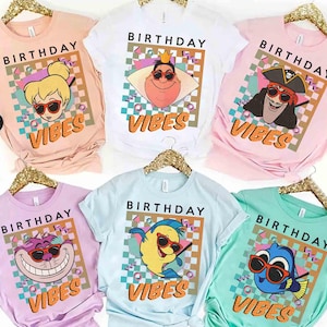 May include: Six t-shirts in various pastel colours, each with a cartoon character wearing sunglasses and the words "BIRTHDAY VIBES". The shirts are in pink, white, lilac, light blue, and mint green, perfect for a birthday celebration.