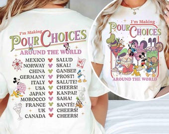 May include: Cream-colored t-shirt with the phrase "I'm Making Pour Choices Around The World" in a whimsical font. The design features cartoon characters and cocktails, with a list of countries and corresponding cheers.