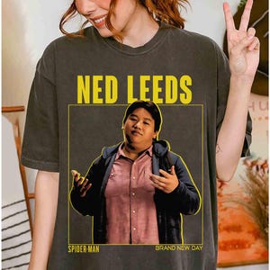 May include: A set of three ceramic canisters with lids, featuring a speckled white glaze and a minimalist design. The canisters vary in size, suitable for kitchen storage. The largest canister measures approximately 8 inches in height.