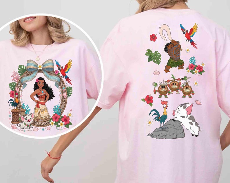 May include: A light pink t-shirt featuring a circular graphic of a female character with long dark hair, a blue bow, a parrot, and a pig. The back of the shirt displays a larger print of the same character, a parrot, three coconut creatures, a rooster, and a pig.