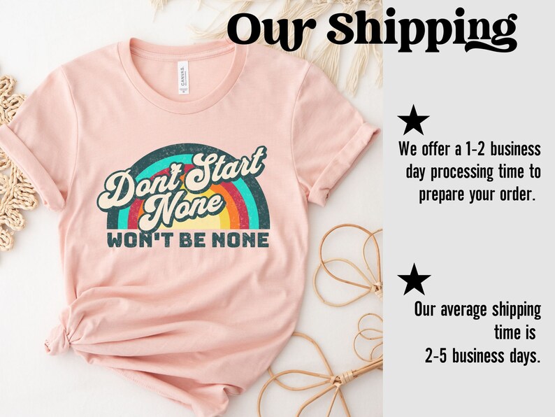 May include: A pink t-shirt with a rainbow graphic and the text "Don't Start None Won't Be None".