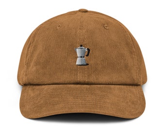 May include: A brown corduroy baseball cap with an embroidered image of a silver coffee pot.