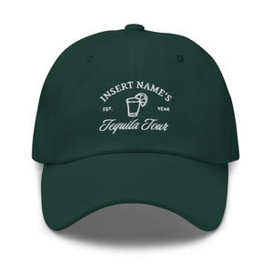 May include: A dark green baseball cap with white embroidery that reads "INSERT NAME'S EST. YEAR Tequila Tour" and a small image of a shot glass with a lime wedge.
