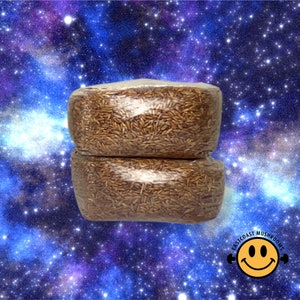 May include: Two packs of dried mushrooms, wrapped in clear plastic, against a background of a galaxy with stars and nebulae.