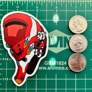 May include: A red and white anime-style sticker featuring a robot head with the Japanese characters "第" and "号" on the side.