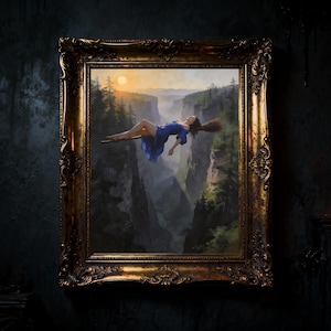 May include: A painting in an ornate gold frame shows a woman in a blue dress floating above a canyon. The background features a sunset over a forest and mountains. The artwork is displayed against a dark, textured wall.