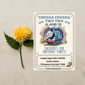 May include: A rectangular birthday party invitation featuring a blue steam engine train, colorful balloons, and the text CHUGGA CHUGGA TWO TWO ALL ABOARD FOR JACKSON'S 2ND BIRTHDAY PARTY, with event details including date, time, location, and RSVP phone number.