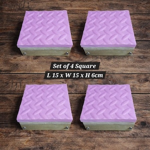 May include: Set of four square blocks. Each block has a light purple, diamond-patterned top, a wooden base, and metal hardware. The text on the image reads: Set of 4 Square, L 15 x W 15 x H 6cm.