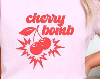 Cherry Bomb Tee Retro Style Vintage Clothing Statement Piece Pop Art Graphic Shirt Cotton Top Trendy Design Fruit Motif Cool Aesthetic