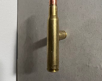 Rifle cartridge cupboard door handle