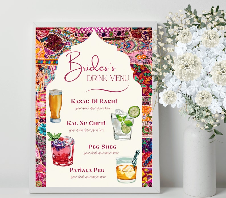 May include: A framed "Bride's Drink Menu" with a colorful, patterned background. The menu features watercolor illustrations of cocktails and the names "Kanak Di Rakhi", "Kal Nu Chuti", "Peg Sheg", and "Patiala Peg". A vase of white flowers is to the right.