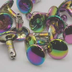 May include: A group of iridescent metal rivets with a domed head and a post. The rivets have a rainbow finish with shades of purple, green, blue, and gold.