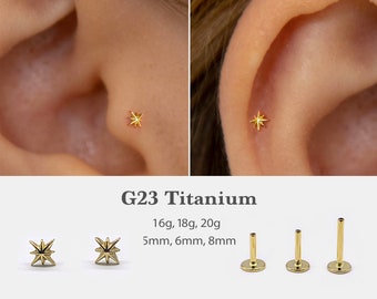 May include: Gold star-shaped titanium body jewelry for a nose or ear piercing. The jewelry is available in 16g, 18g, and 20g gauges and 5mm, 6mm, and 8mm lengths. G23 Titanium.