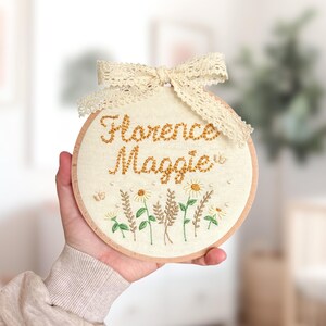 Baby name sign embroidered with flowers | personalised announcement plaque and nursery wall hanging