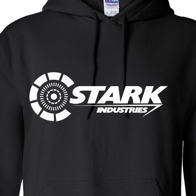 May include: Black hooded sweatshirt with a white graphic of the Stark Industries logo, featuring the Iron Man arc reactor design and the text "Stark Industries".