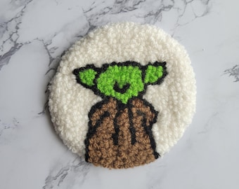 Posavasos con diseño de bebé extraterrestre