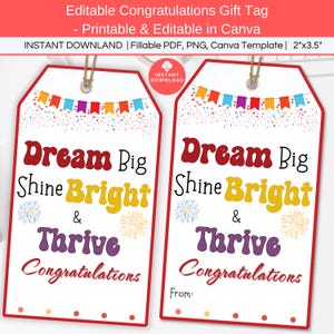 May include: Two printable gift tags with a red, white, and blue confetti background. The text on the tags reads "Dream Big Shine Bright & Thrive Congratulations". The tag on the right has a space for a name to be written.