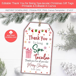 May include: Printable Christmas gift tag with a red border and white background. The tag features a festive design with snowflakes, stockings, and a gift box. The text reads "Thank you for being Spa-tacular. Thank you for all you do! Merry Christmas. From: Santa."
