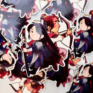 May include: A die-cut sticker featuring two cartoon characters back-to-back. One character has long black hair and holds a black sword, while the other has reddish-brown hair and holds a bow and arrow. Both wear blue and red traditional-style clothing.