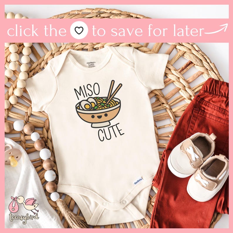 May include: A white baby onesie with a cartoon illustration of a bowl of miso ramen with chopsticks. The text "Miso Cute" is printed below the bowl.
