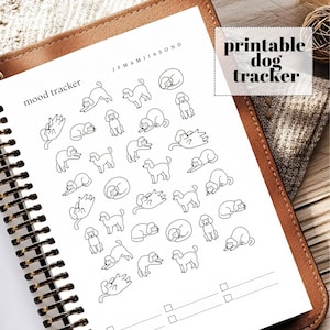 May include: A printable dog mood tracker with poodle illustrations. The black and white design features various poses of poodles, with the words "mood tracker" and "printable dog tracker" visible. The tracker is in a spiral-bound notebook.