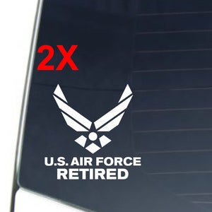 May include: Two white vinyl decals featuring the U.S. Air Force logo and the text "U.S. AIR FORCE RETIRED".