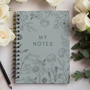 May include: A grey spiral notebook with a floral design and the text "MY NOTES" on the front cover.