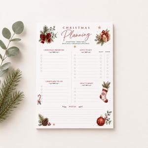 May include: A white Christmas planning notepad featuring sections for priorities, gifts to buy, to-do lists, and notes. The page is decorated with watercolour illustrations of pine branches, a red bow, a gift box, a stocking, and a red ornament.