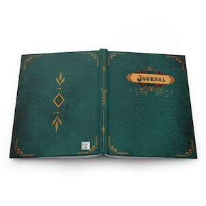 May include: A green journal with a gold decorative design and the word "JOURNAL" on the front cover.
