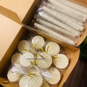 1 Dozen White Chocolate Covered Pretzels & 1 Dozen White Chocolate Oreos! Drizzled in White Chocolate! Read messages for delivery updates!