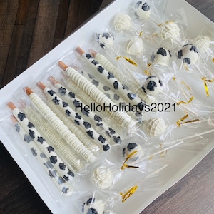 1 Dozen Cow Print Cake Pops/1 Dozen Cow Print Pretzels. Mix of Cow Print/Drizzle! HEAT SENSITIVE!
