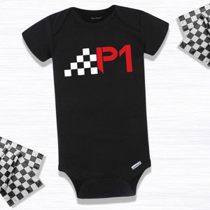 May include: Black baby onesie with a red "P1" and a checkered flag design.