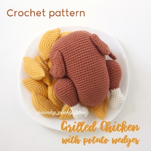 May include: Crochet pattern for a brown amigurumi grilled chicken with white legs and yellow potato wedges on a white plate. The text "Grilled Chicken with potato wedges" is written below the plate. The text "@pinky_pinky_blue" is written below the plate.