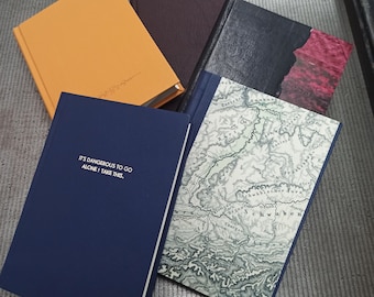 Carnets de voyage fabriqués à la main avec de grandes perforations