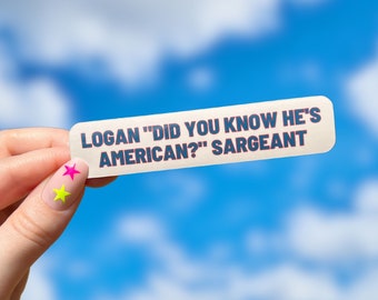 May include: A white sticker with blue text that reads "Logan "Did you know he's American?" Sargeant". The sticker is held by a hand with two colorful star-shaped nail stickers.