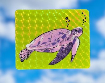 May include: A holographic sticker featuring a purple sea turtle swimming in a green and yellow background with bubbles.