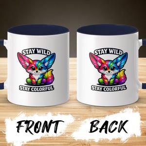 Two white mugs with navy handles, each featuring a colorful fox and text.