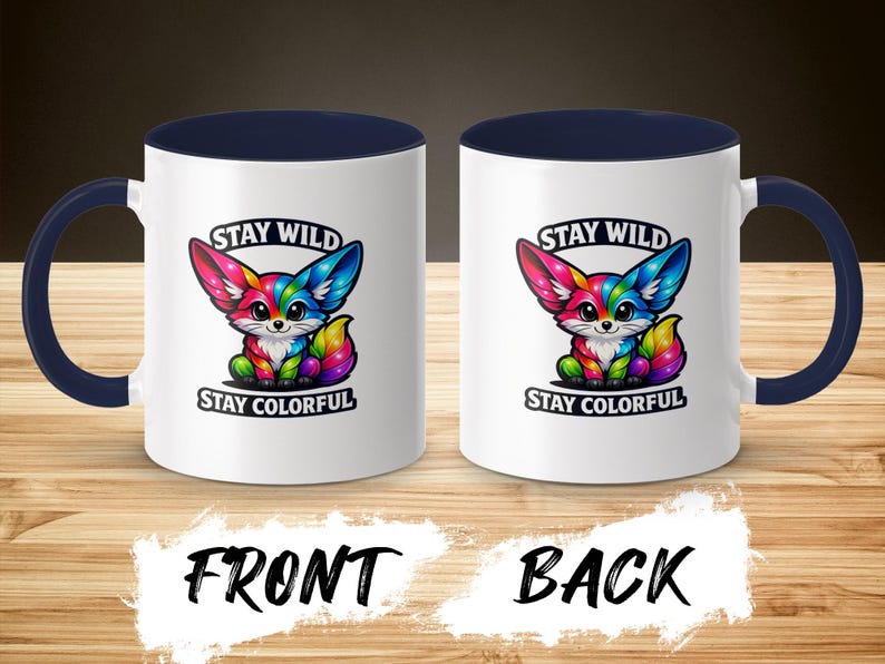 Two white mugs with navy handles, each featuring a colorful fox and text.