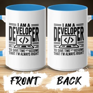 White mug with blue handle, features "I AM A DEVELOPER" text and code bracket graphic.